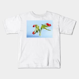 Wilted tulip flowers in the glass Kids T-Shirt